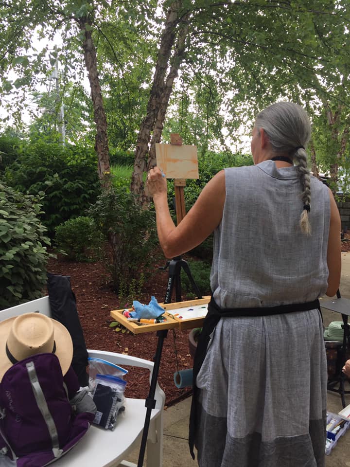 Resident painting under the birch trees